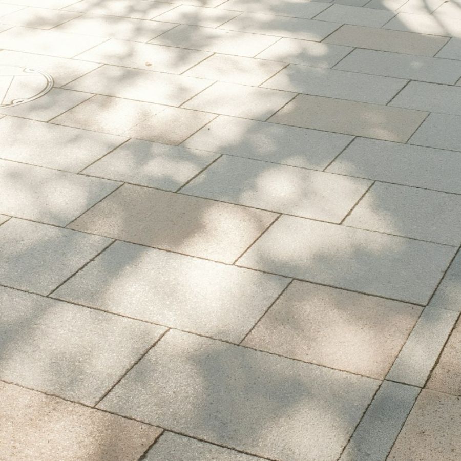 Sidewalk of large concrete paving slabs (representative image)